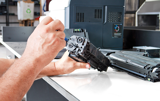 man fixing a copier using various Copier Supplies in Ely, MN, Grand Rapids, MN, Virginia, MN, Biwabik, Aurora, MN, Hoy Lakes